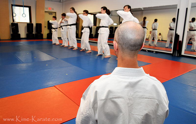 Sensei Keyes watching students during their black belt promotion.